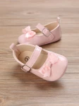 pink patent baby shoes, bow-adorned baby shoes, elegant baby shoes, shoes for infants, comfortable baby shoes, high-quality patent shoes, baby shoe size guide