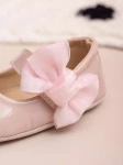 pink baby shoes, bow-adorned baby shoes, elegant baby shoes, shoes for infants, comfortable baby shoes, high-quality patent shoes, baby shoe size guide