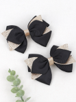 Elegant hair clips, black bow clips, girls' accessories Ireland, stylish hair accessories, hair clips for sensitive skin, hair clips for girls, versatile hair clips, black and gold clips, high-quality hair clips, children's fashion accessories