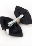 Elegant hair clips, black bow clips, girls' accessories Ireland, stylish hair accessories, hair clips for sensitive skin, hair clips for girls, versatile hair clips, black and gold clips, high-quality hair clips, children's fashion accessories