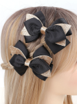 Elegant hair clips, black bow clips, girls' accessories Ireland, stylish hair accessories, hair clips for sensitive skin, hair clips for girls, versatile hair clips, black and gold clips, high-quality hair clips, children's fashion accessories