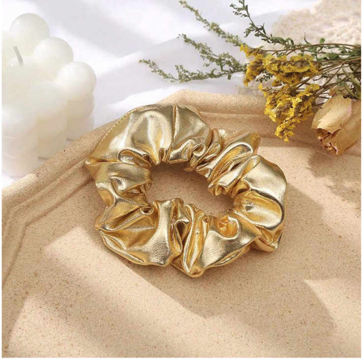 Golden scrunchie Ireland, children's hair accessories, elegant hair tie, metallic scrunchie, soft hair accessory, girls fashion Ireland, special occasion hairband, gentle hair scrunchie, stylish hair accessory, gift for girls