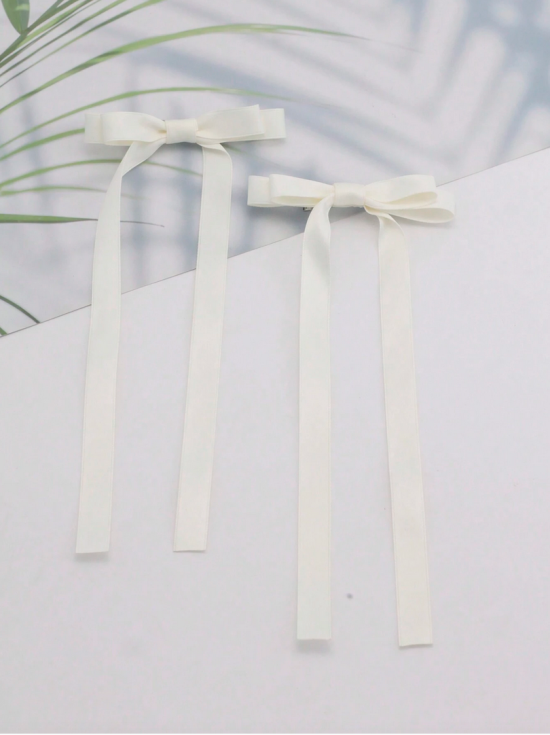 hair clips for girls, satin bow clips, elegant hair accessories, cream hair bows, girls’ hair clips, special occasion accessories, children’s hair clips Ireland