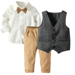 Boy in Enzo Heritage Ensemble at Irish Communion – Crisp white shirt and amber bow tie.