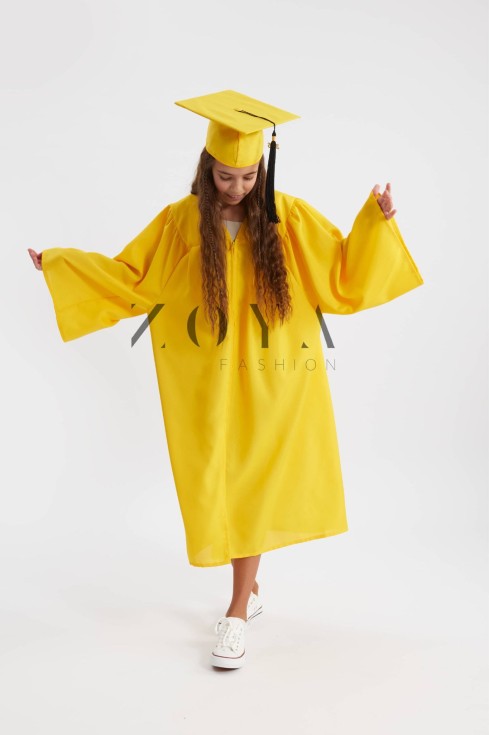 Vibrant sunshine yellow graduation gown on young scholar at Irish ceremony