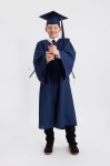 Adult graduate in navy robe with 2026 charm – timeless academic attire