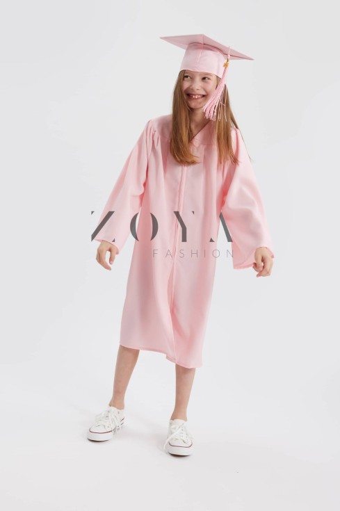 Blush pink graduation gown on child at Irish primary school ceremony