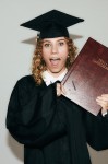 Young Graduate Adjusting Academic Cap with 2025 Charm