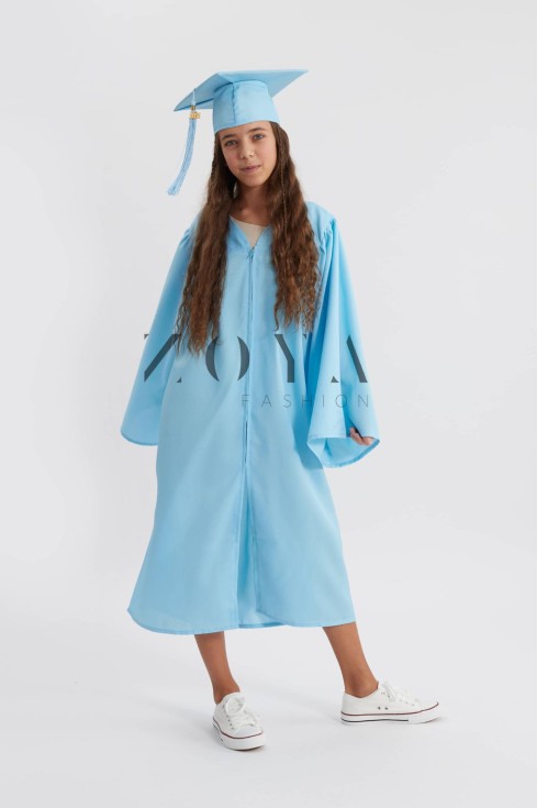 Child in sky blue graduation gown walking proudly at Irish ceremony