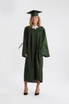 Child in forest green graduation gown walking across stage – Elegant kids’ graduation gown in Ireland