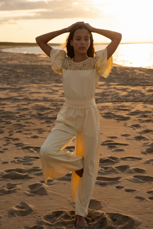 Front view of Beatrice Yellow Girls’ Jumpsuit – elegant lace detail