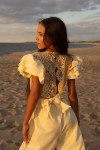 Close-up of delicate lace neckline in Beatrice jumpsuit