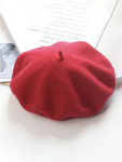 Top view of girls red beret with classic stalk