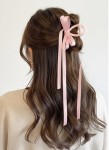 Close up of satin ribbon bows with couture length tails