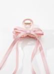 Girls half up hairstyle styled with blush satin bow clip