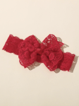 Stretchy red headband with lace bow on infant for christening wear