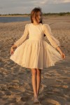 Girls beige tulle dress with high neckline and sheer long sleeves