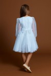 Twirl shot of Holly dress showing layered tulle and above-knee length