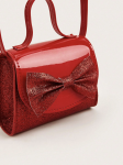 Red girls party bag with adjustable crossbody strap side angle