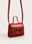Interior and hook-and-loop fastening of red girls party handbag