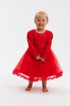 Girl wearing Kayra red party dress with lace bodice and tulle skirt in Ireland