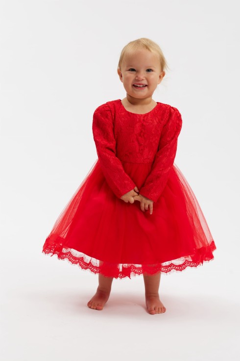 Girl wearing Kayra red party dress with lace bodice and tulle skirt in Ireland