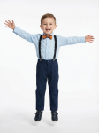 Boy in sky-blue Christian shirt with amber bow tie at Irish wedding