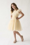 Side view of Paola butter-yellow tulle dress with flared skirt