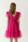 Side view of fuchsia tulle girls dress with flared skirt