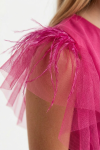 Tulle overlay fabric close-up on fuchsia girls dress