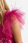Girl styled in fuchsia Gabi occasion dress for a party
