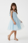 Girl styled in light blue Rina dress for First Holy Communion