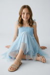 Light blue Suzi girls dress side view, flared midi cut