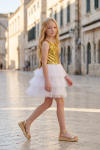 Riva white and gold dress for girls outdoors – sequin top and layered tulle skirt, side view