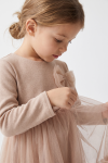 Iga beige dress for girls – tulle bow on the chest and long-sleeved knit top, close-up from the side