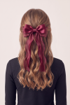 Burgundy bow hair clip for girls in the hair, long tails – back view