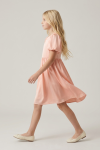 Sia pink party dress for girls – profile, flared knee-length skirt in motion