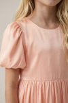 Sia pink party dress for girls – close-up of the round neckline and puff sleeve