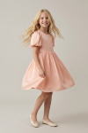 Sia pink party dress for girls – twirling, flared skirt in motion, studio shot
