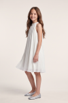 Rozalia white pleated dress for girls – side view, knee-length A-line cut