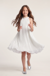Rozalia white pleated dress for girls – front view, flared hem in motion