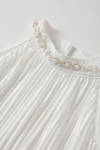 Rozalia white dress for girls – detail of the stand-up collar with pearls and small beads in a wavy pattern