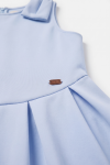 Harper light blue dress for girls – detail of the shoulder bow and the pleats at the waist