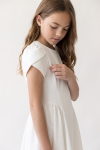 Rumi white dress for girls – tulip sleeve and gathered skirt below the waist seam, side view