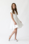 Rumi white dress for girls – flared knee-length skirt in motion, front view