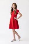 Rumi red dress for girls – three-quarter view, fitted top and flared skirt