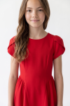 Rumi red dress for girls – top with tulip sleeves and round neckline, front view