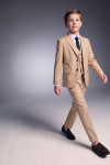 Liam beige suit for boys – blazer, waistcoat, trousers and black tie, in motion, front view