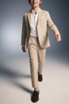 Liam beige suit for boys – trousers and open blazer, in motion, front view