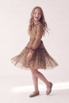 Holly leopard print dress for girls – flared tulle skirt mid-twirl, side view